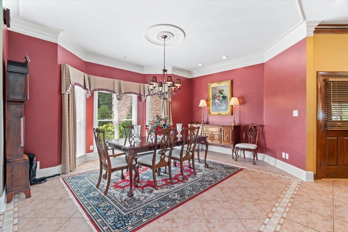 1226 Oak Lake Circle Collierville, TN 38017 - Photo 10 of 39 a view of a dining room with furniture window and outside view
