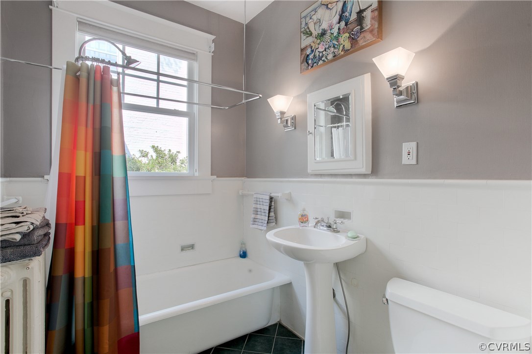 5015 Caledonia Road Richmond, VA 23225 - Photo 14 of 29 First floor bath with pedestal sink and ceramic ti
