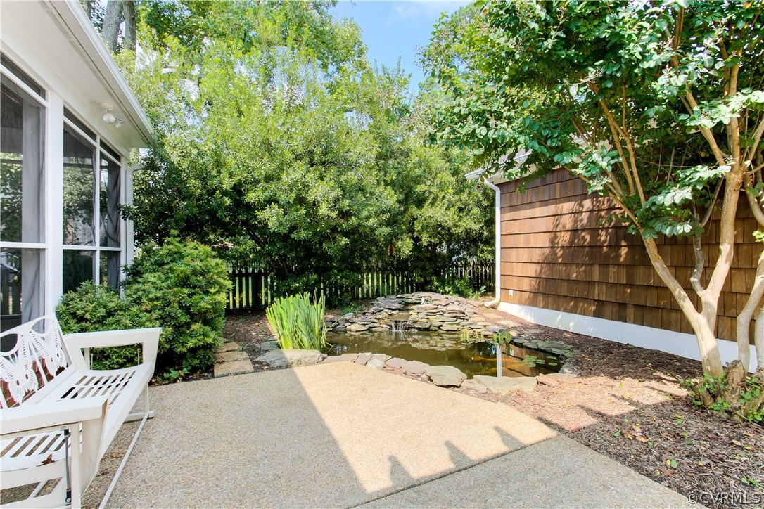 5015 Caledonia Road Richmond, VA 23225 - Photo 23 of 29 View of the koi pond with a water fall feature off