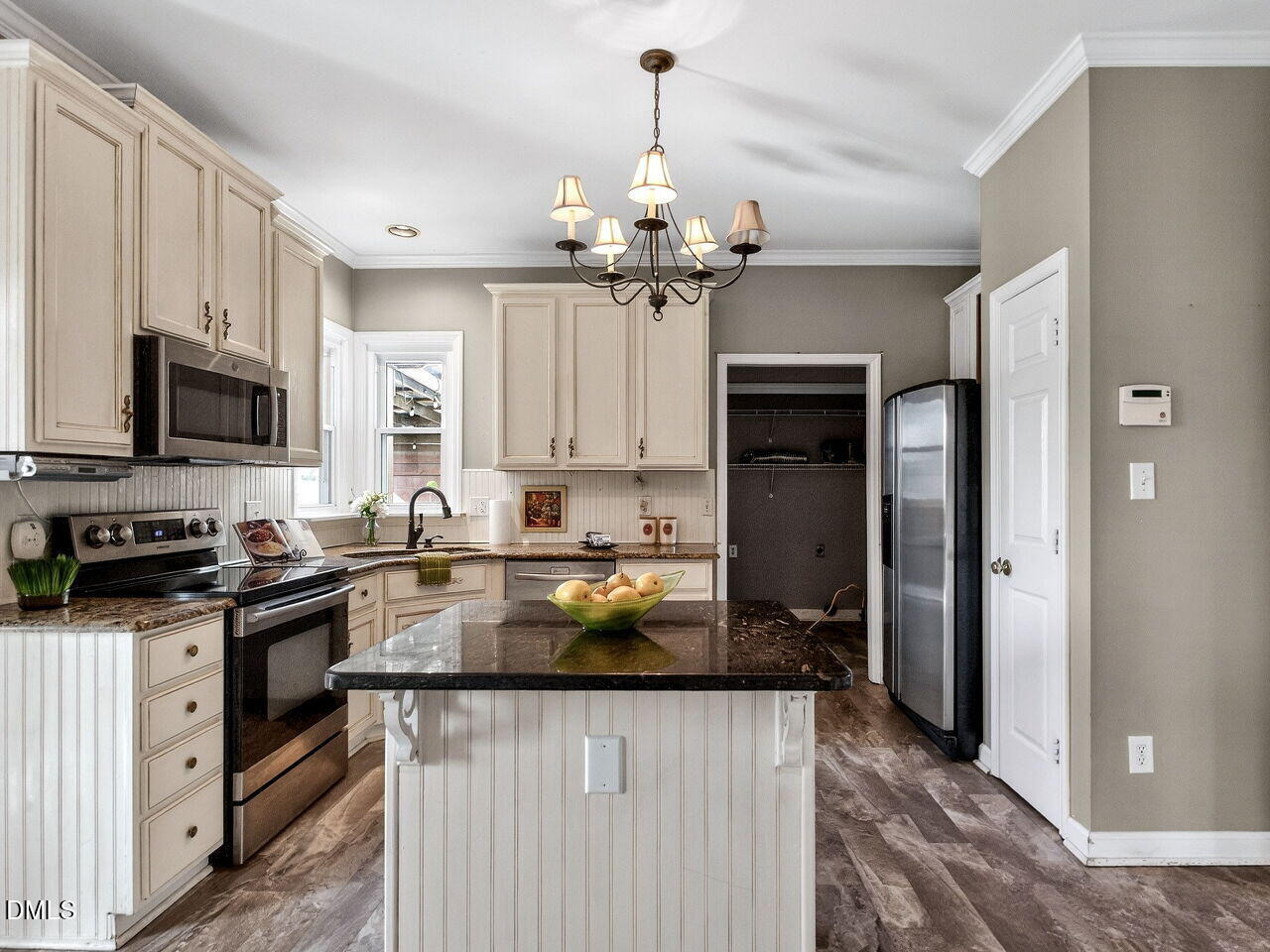 4500 Rivershyre Way Raleigh, NC 27616 - Photo 16 of 42 a kitchen with kitchen island granite countertop a stove oven and a sink with granite countertops