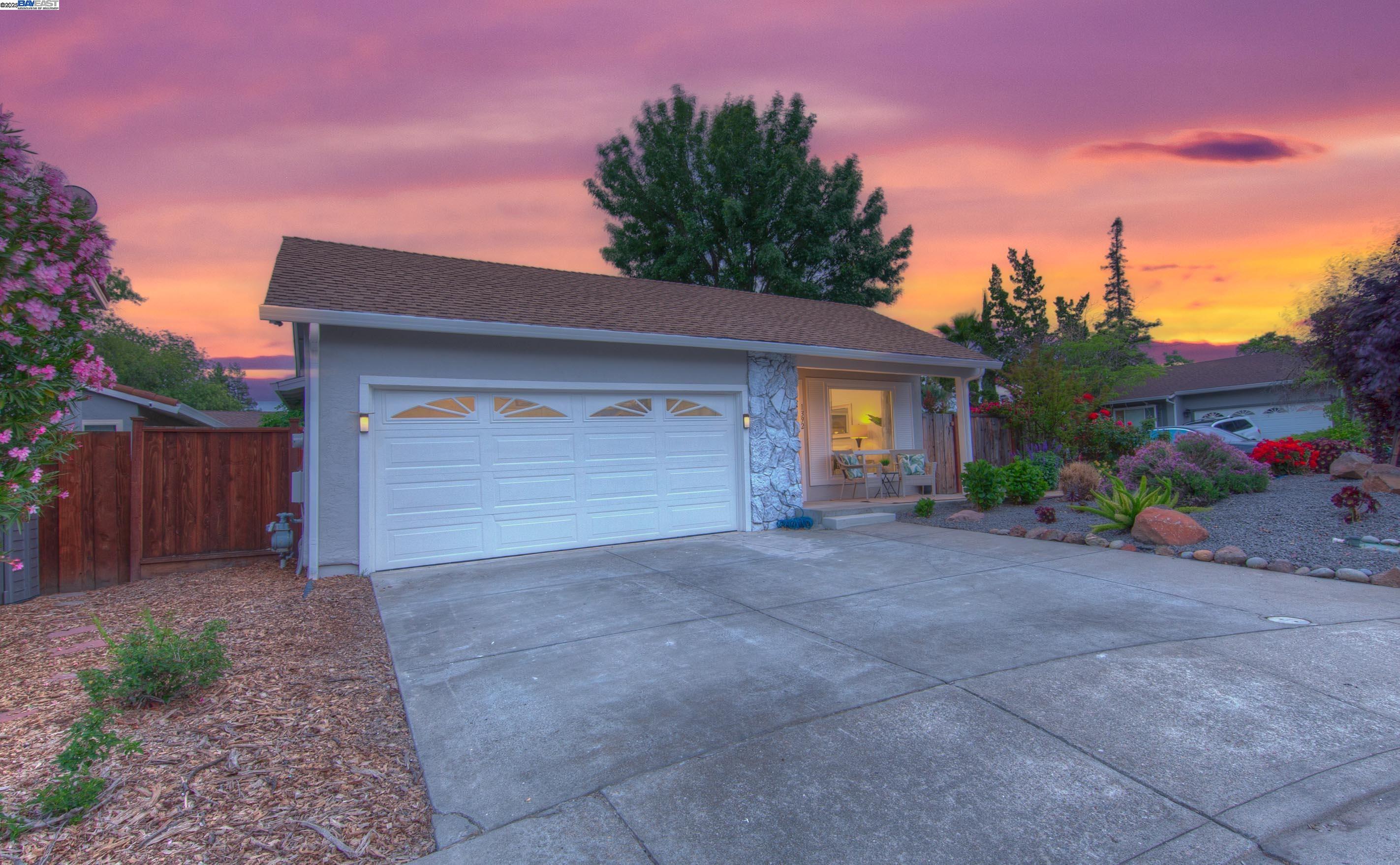 a front view of house with garage and yard