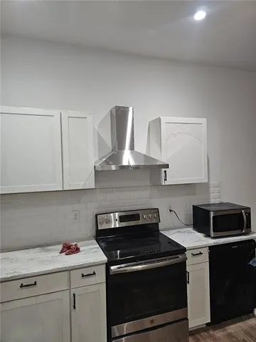 a kitchen with a stove and a sink