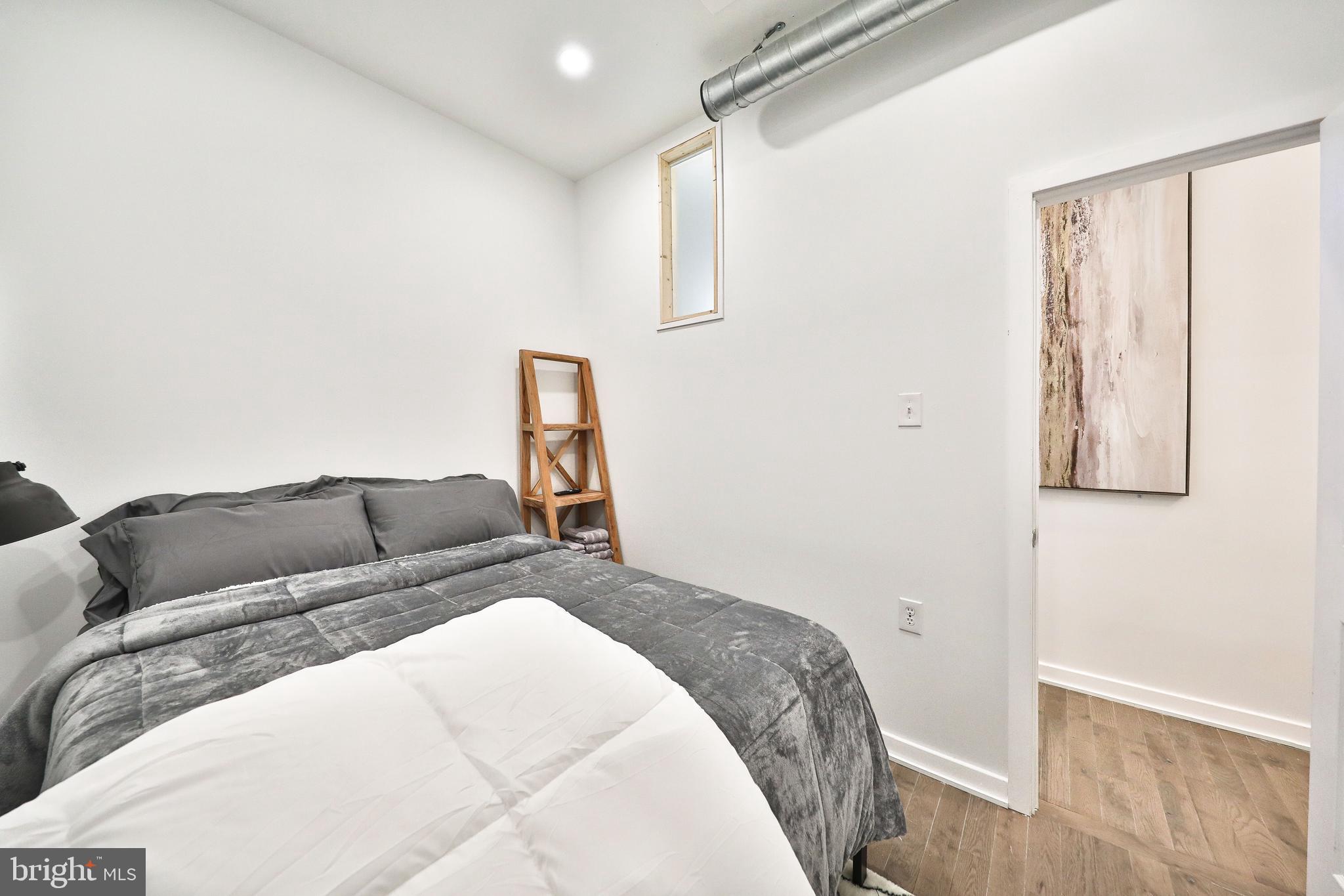 3217 Turner Street Philadelphia, PA 19121 - Photo 9 of 18 a bedroom with a bed and a window