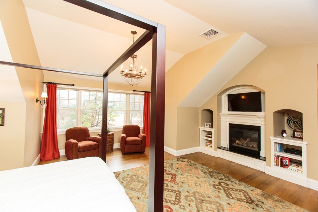 23 Wingate Road Wellesley, MA 02481 - Photo 16 of 23 a living room with furniture a fireplace and a floor to ceiling window