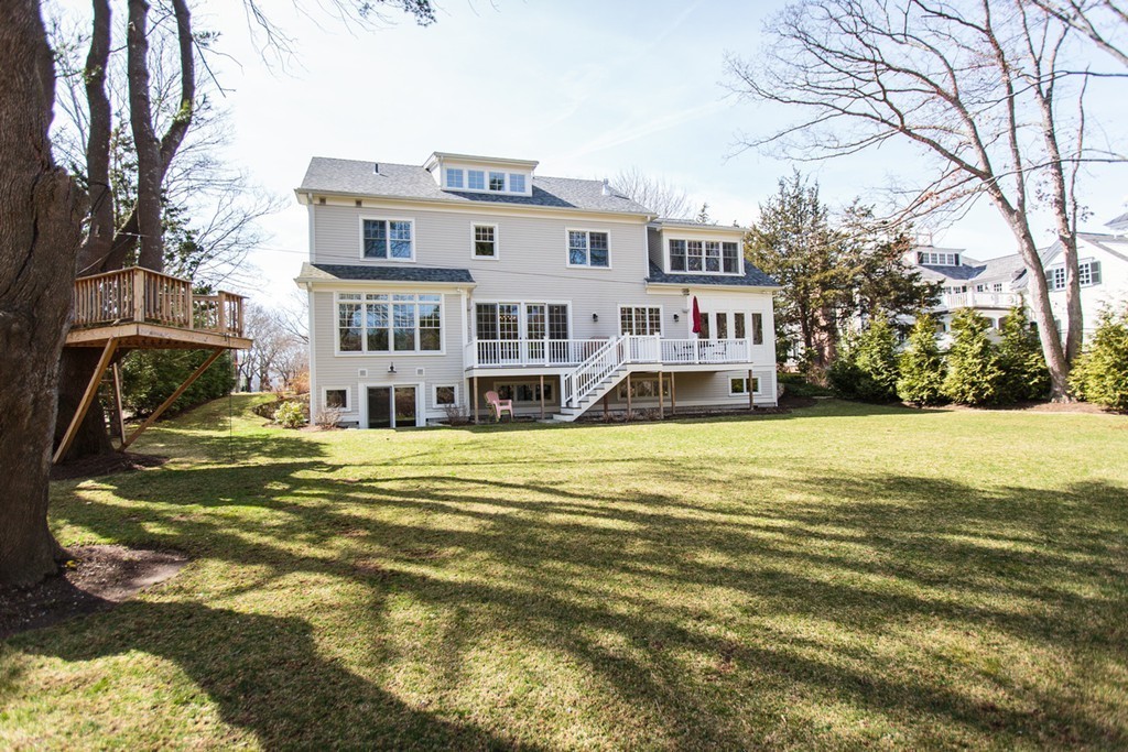 23 Wingate Road Wellesley, MA 02481 - Photo 20 of 23 a front view of residential houses with yard and trees