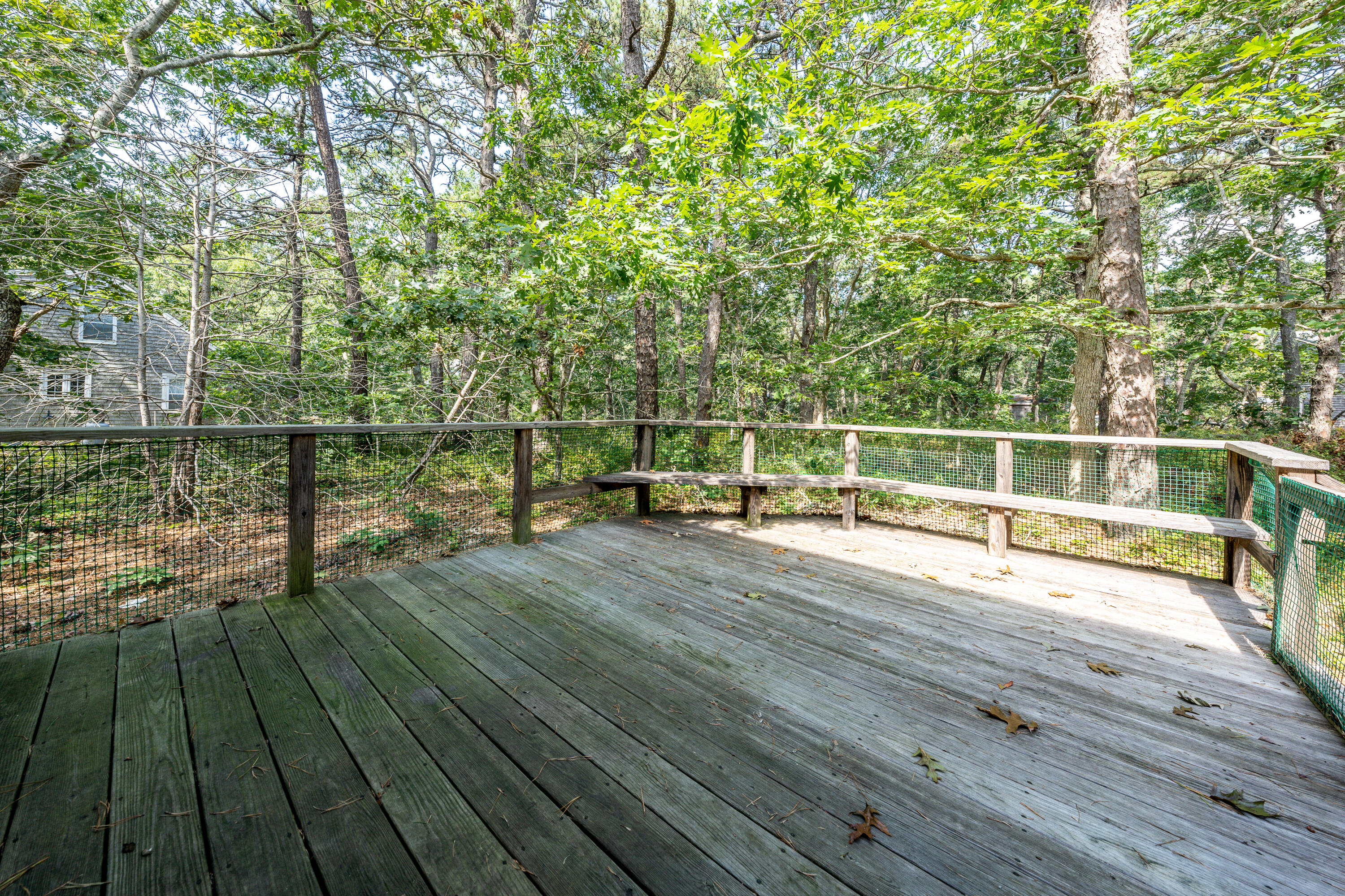 295 Long Pond Road Wellfleet, MA 02667 - Photo 23 of 33 a view of a balcony with wooden floor and fence