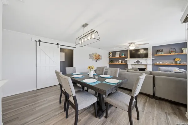 a view of a dining room with furniture and wooden floor