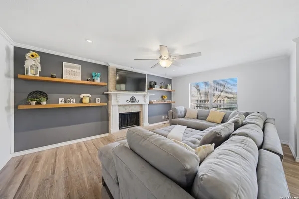 a living room with furniture and a fireplace
