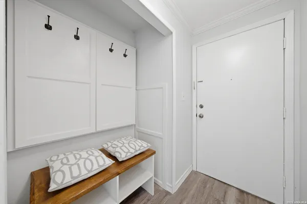 a view of room with window and hardwood floor