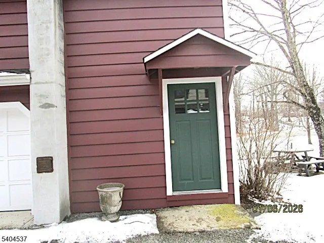 a view of a wooden door of the house