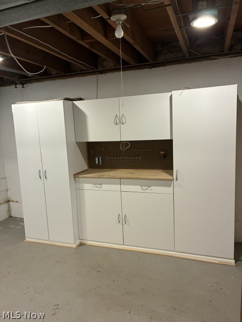 303 Somerset Road Akron, OH 44313 - Photo 20 of 29 A workroom with built ins, on the lower level