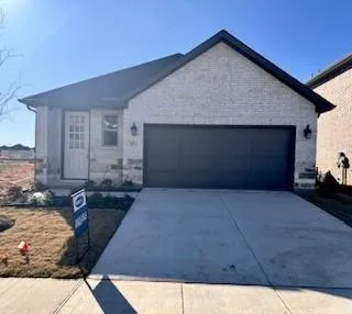 a front view of a house with parking space