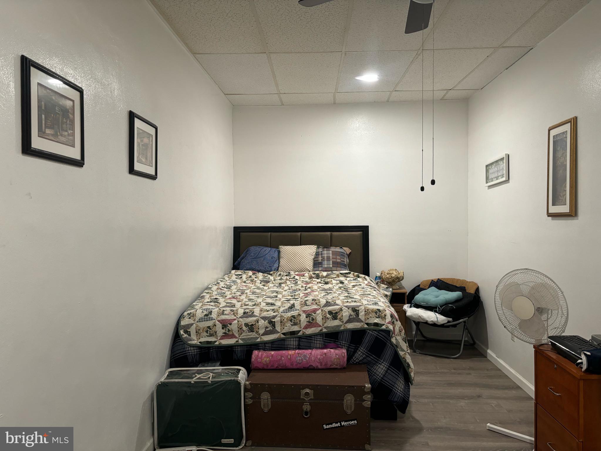 4328 Frankford Avenue, Unit 3A Philadelphia, PA 19124 - Photo 12 of 19 a bedroom with a bed and a dresser
