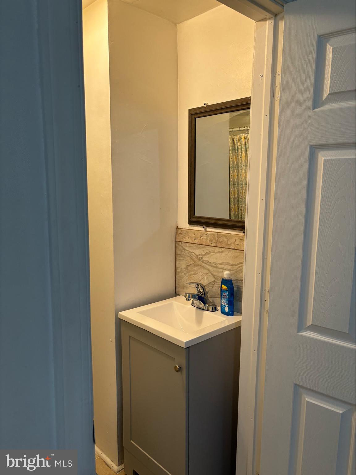 4328 Frankford Avenue, Unit 3A Philadelphia, PA 19124 - Photo 15 of 19 a bathroom with a sink and a mirror