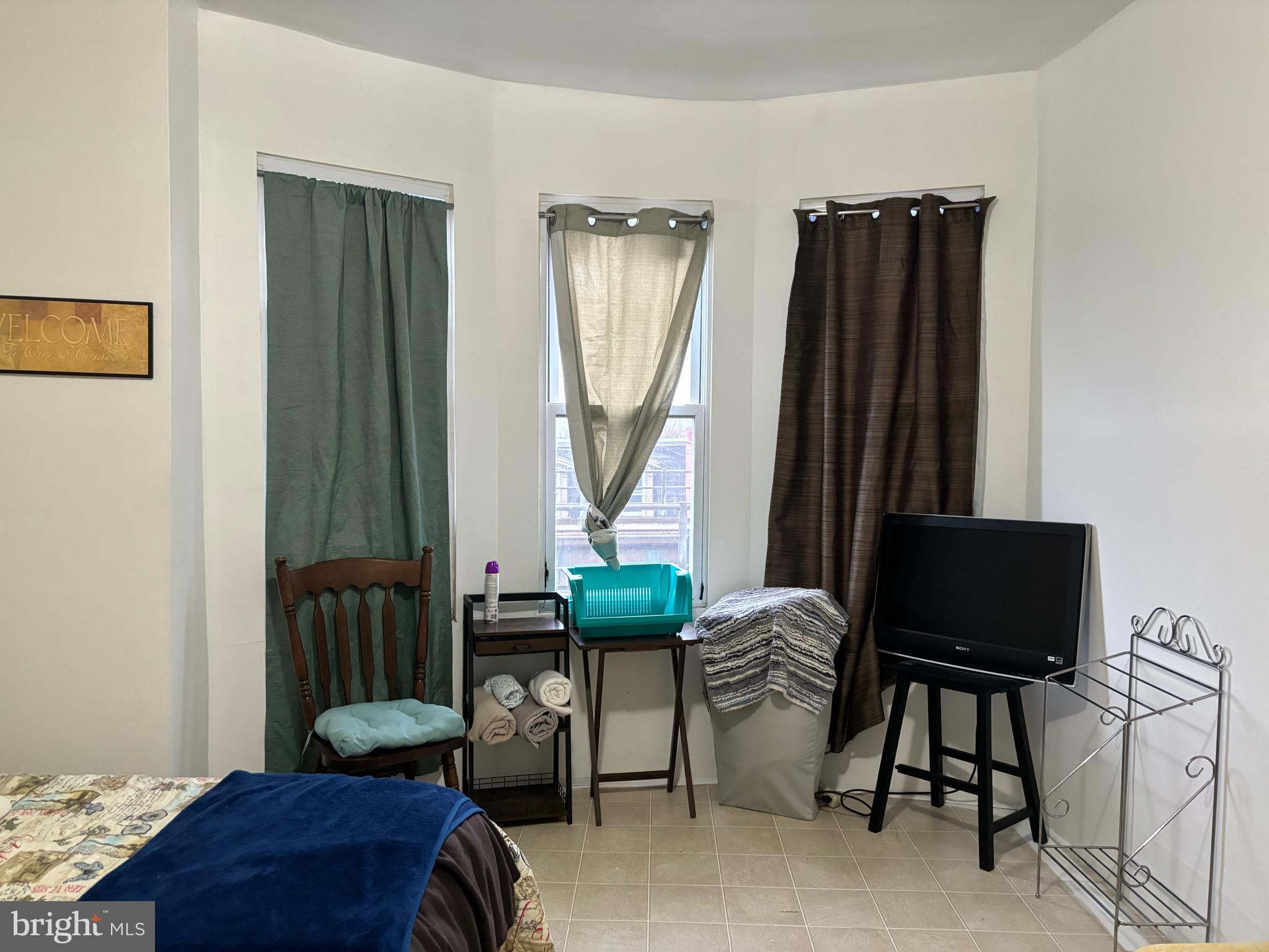 4328 Frankford Avenue, Unit 3A Philadelphia, PA 19124 - Photo 16 of 19 a living room with furniture and a window