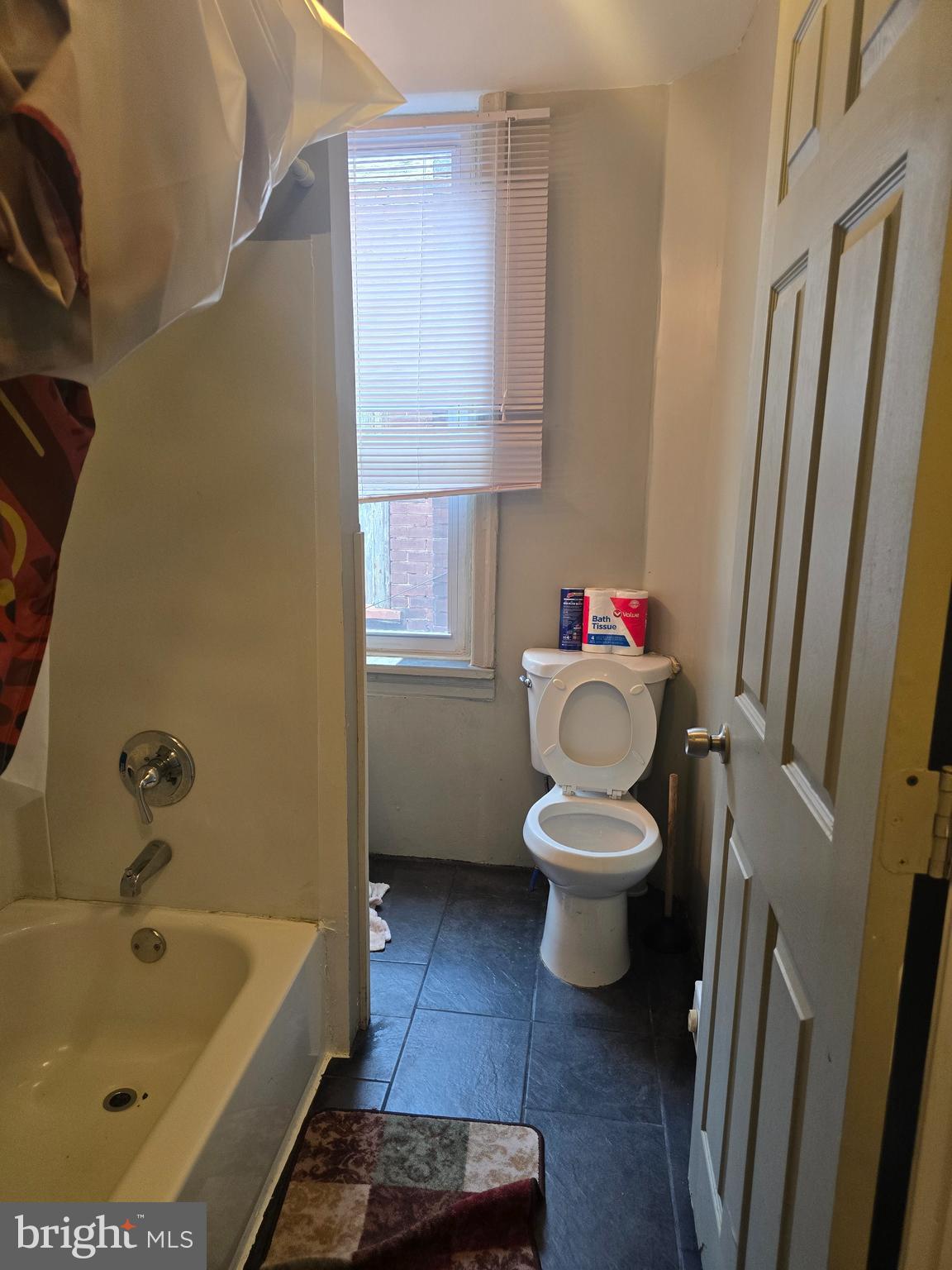 4328 Frankford Avenue, Unit 3A Philadelphia, PA 19124 - Photo 7 of 19 a bathroom with a sink a toilet and a bathtub