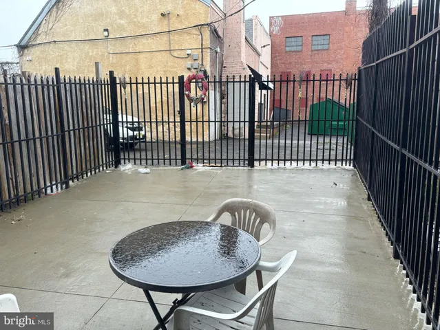 a view of a chairs and tables in the patio