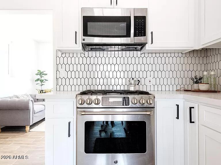 2915 West Griswold Road Phoenix, AZ 85051 - Photo 7 of 17 a kitchen with a stove and a microwave