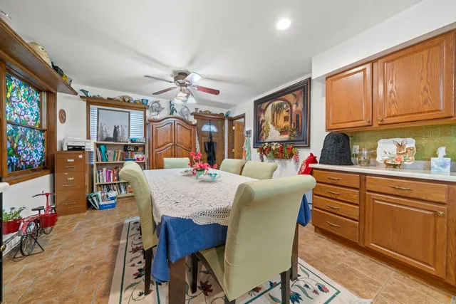 a kitchen with a sink cabinets and window