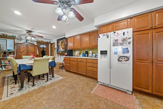 a kitchen with a refrigerator and a sink