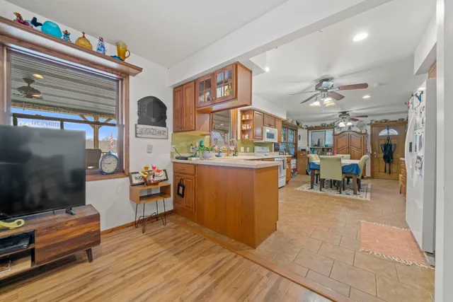 a living room with furniture and kitchen view