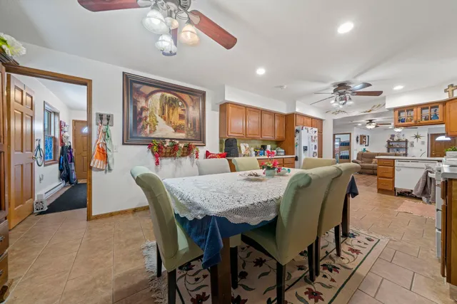 a dining room filled a chandelier and fireplace