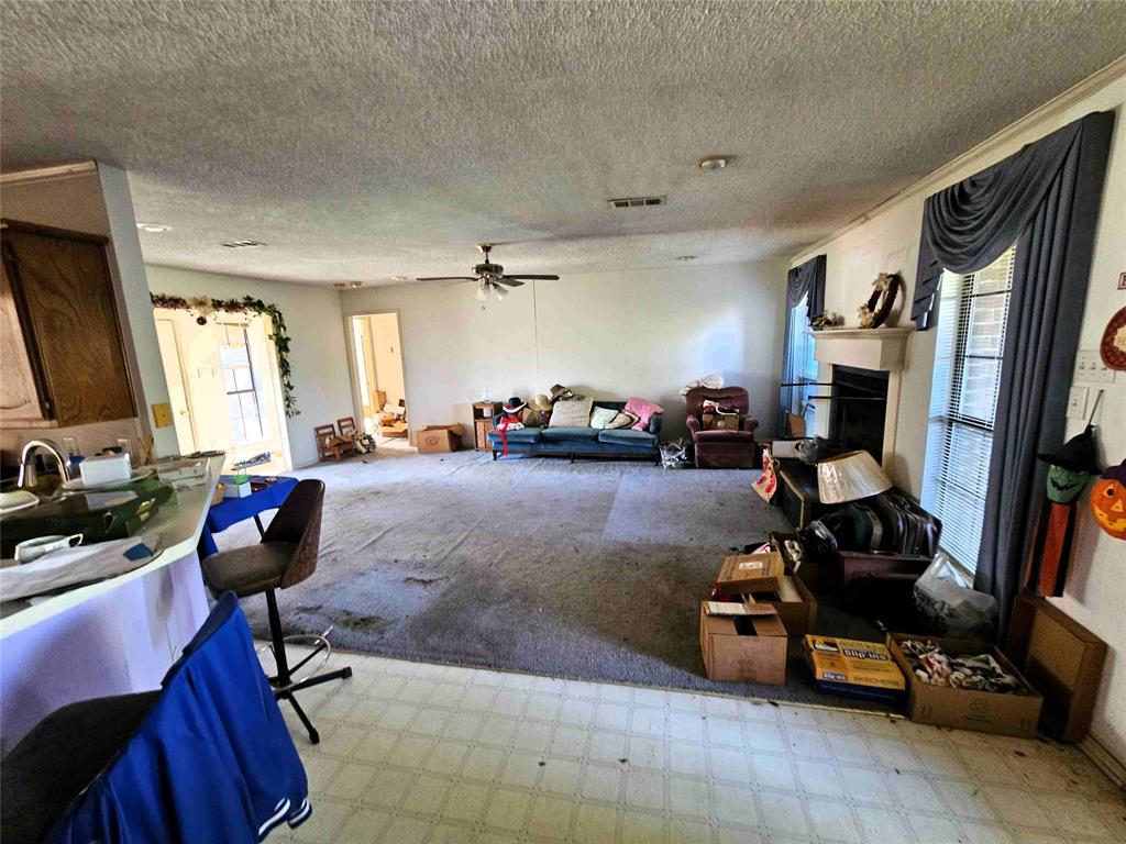 503 Pin Oak Drive Terrell, TX 75161 - Photo 11 of 23 a living room with furniture and a flat screen tv