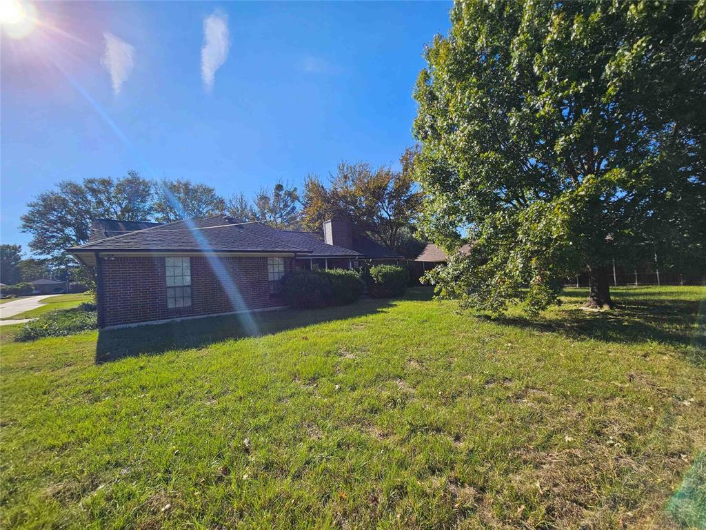 503 Pin Oak Drive Terrell, TX 75161 - Photo 14 of 23 a view of a big yard with an trees