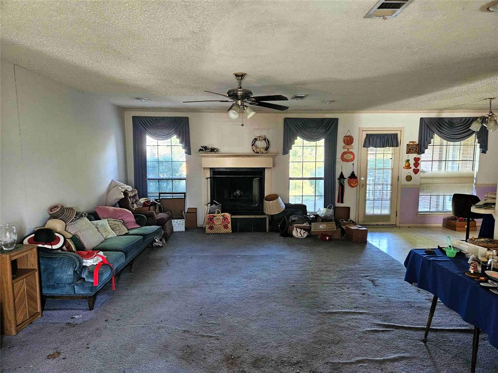 503 Pin Oak Drive Terrell, TX 75161 - Photo 3 of 23 a living room with furniture and a fireplace