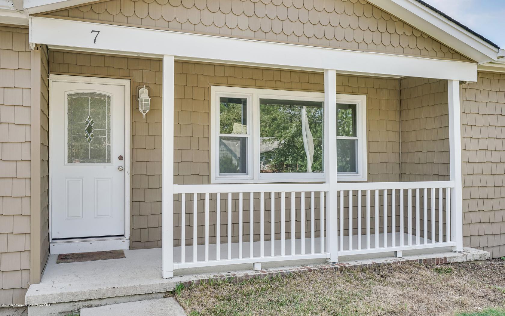 7 Coventry Road Toms River, NJ 08757 - Photo 1 of 34 a view of a porch with a window