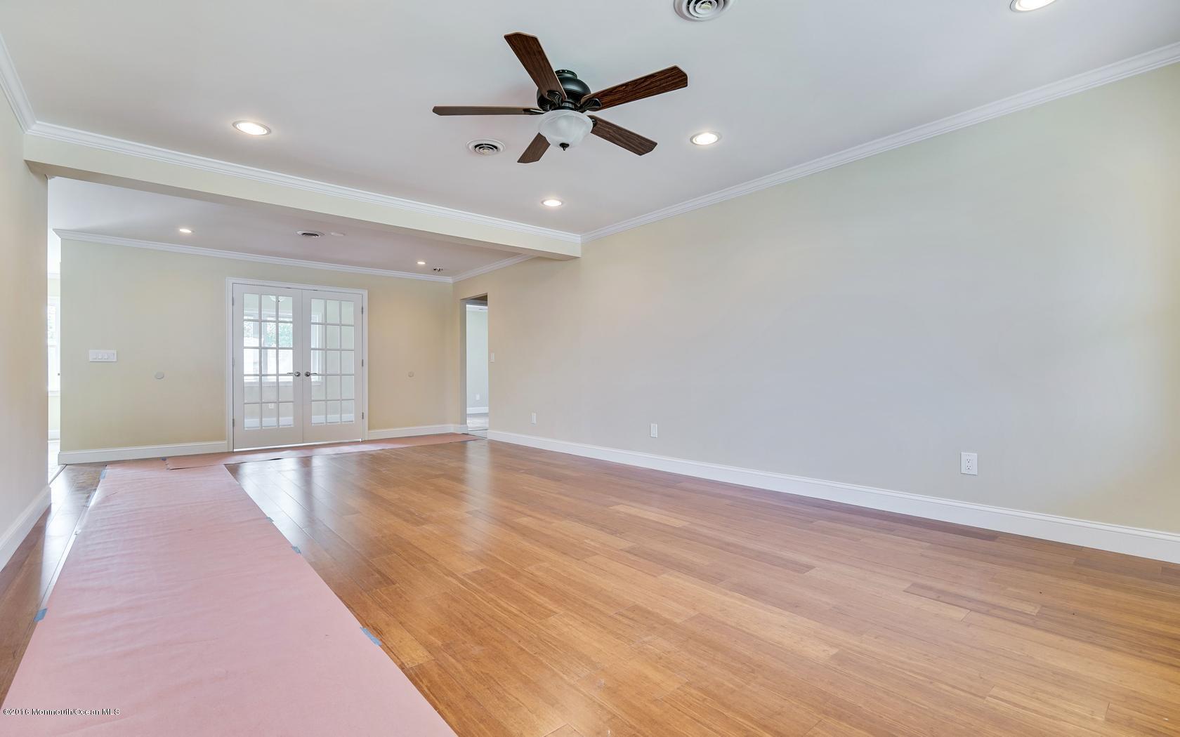 7 Coventry Road Toms River, NJ 08757 - Photo 11 of 34 an empty room with wooden floor and windows
