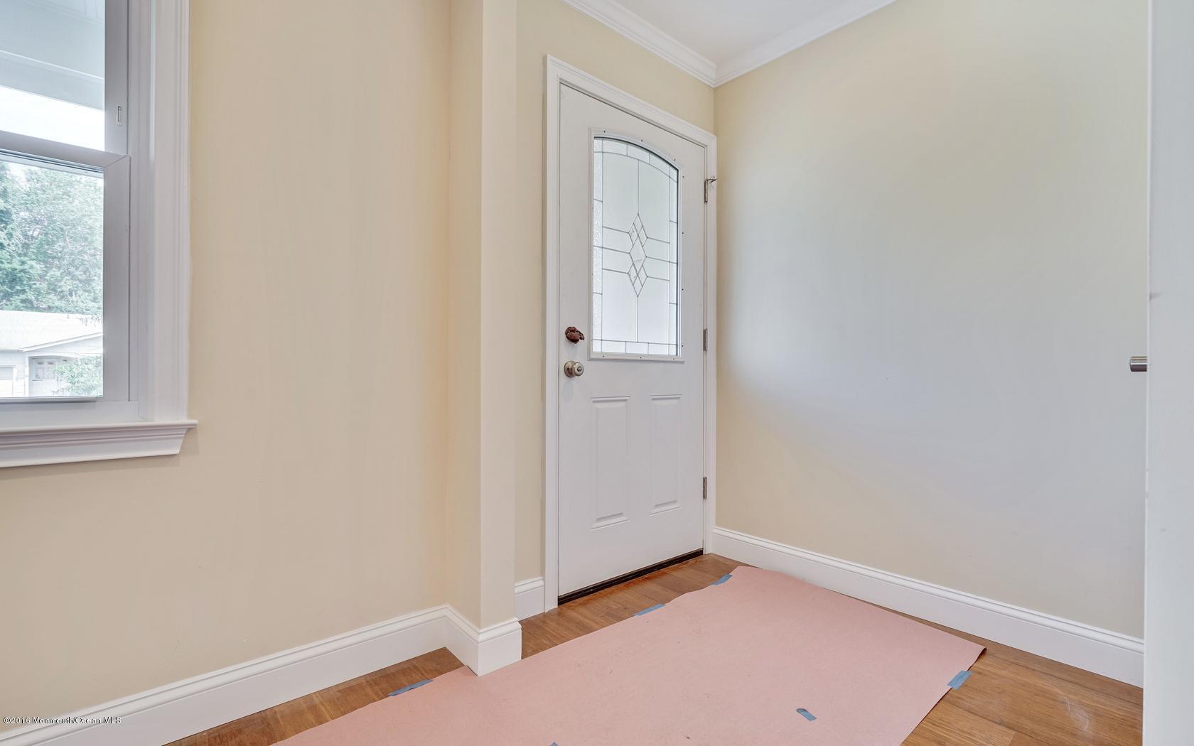 7 Coventry Road Toms River, NJ 08757 - Photo 12 of 34 an empty room with wooden floor and windows