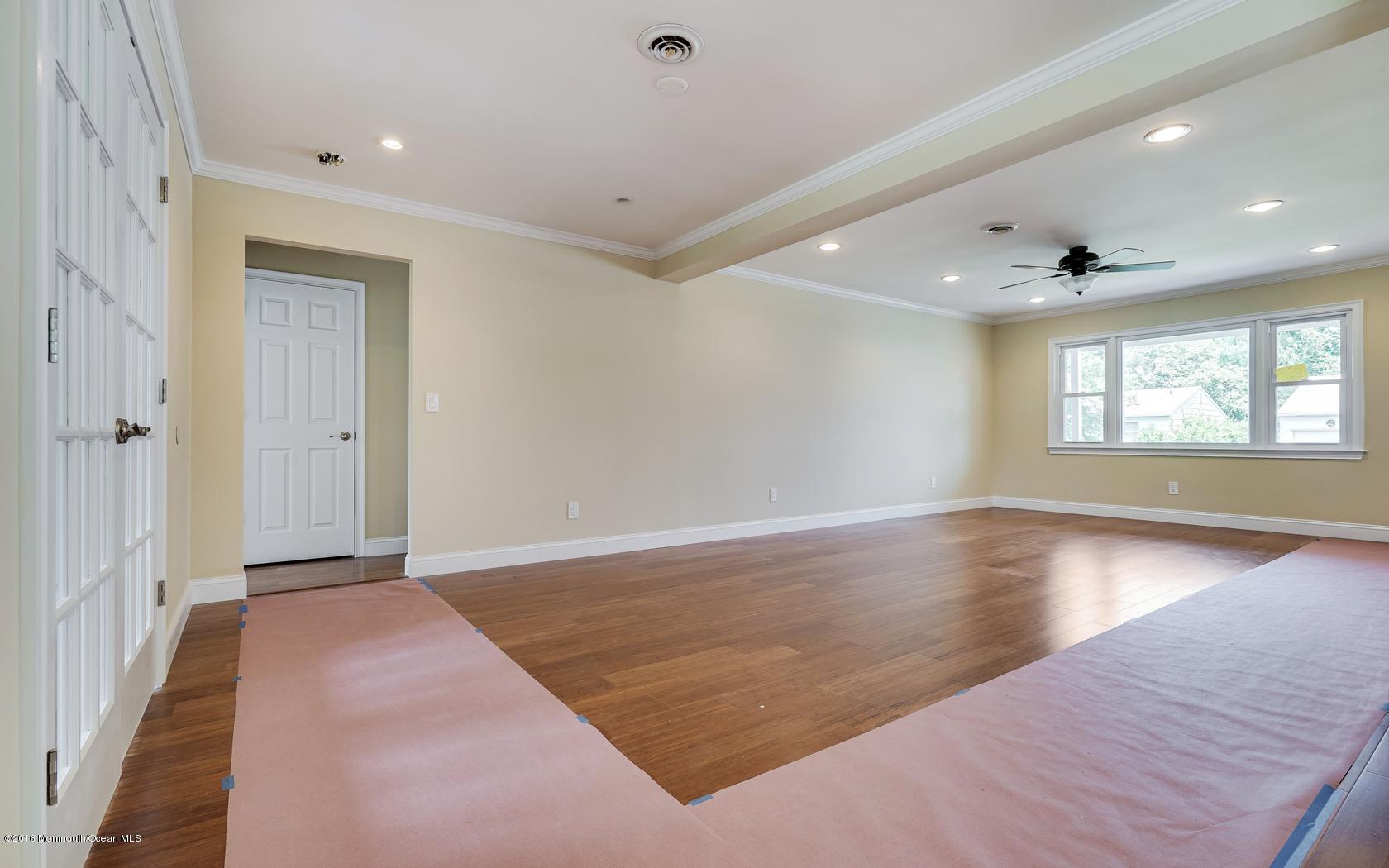 7 Coventry Road Toms River, NJ 08757 - Photo 13 of 34 wooden floor in an empty room with a window