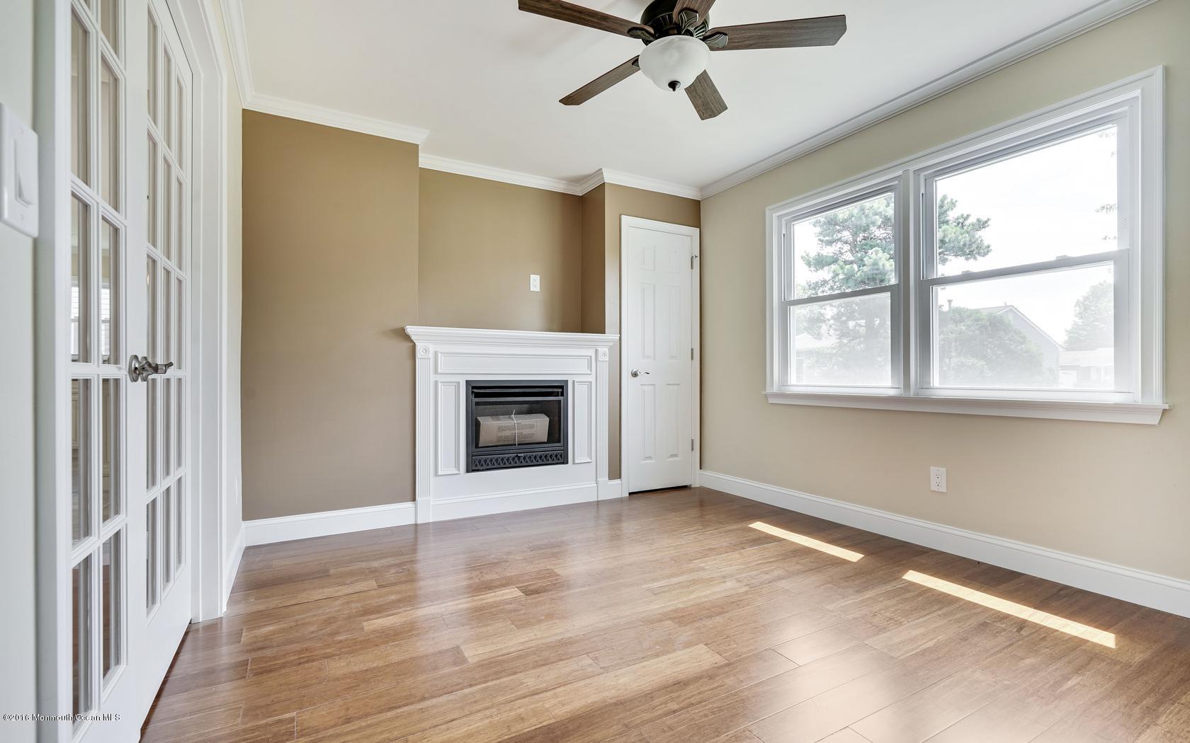 7 Coventry Road Toms River, NJ 08757 - Photo 15 of 34 a view of a livingroom with a ceiling fan and window