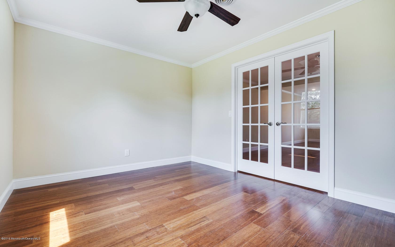 7 Coventry Road Toms River, NJ 08757 - Photo 17 of 34 a view of empty room with wooden floor and ceiling fan