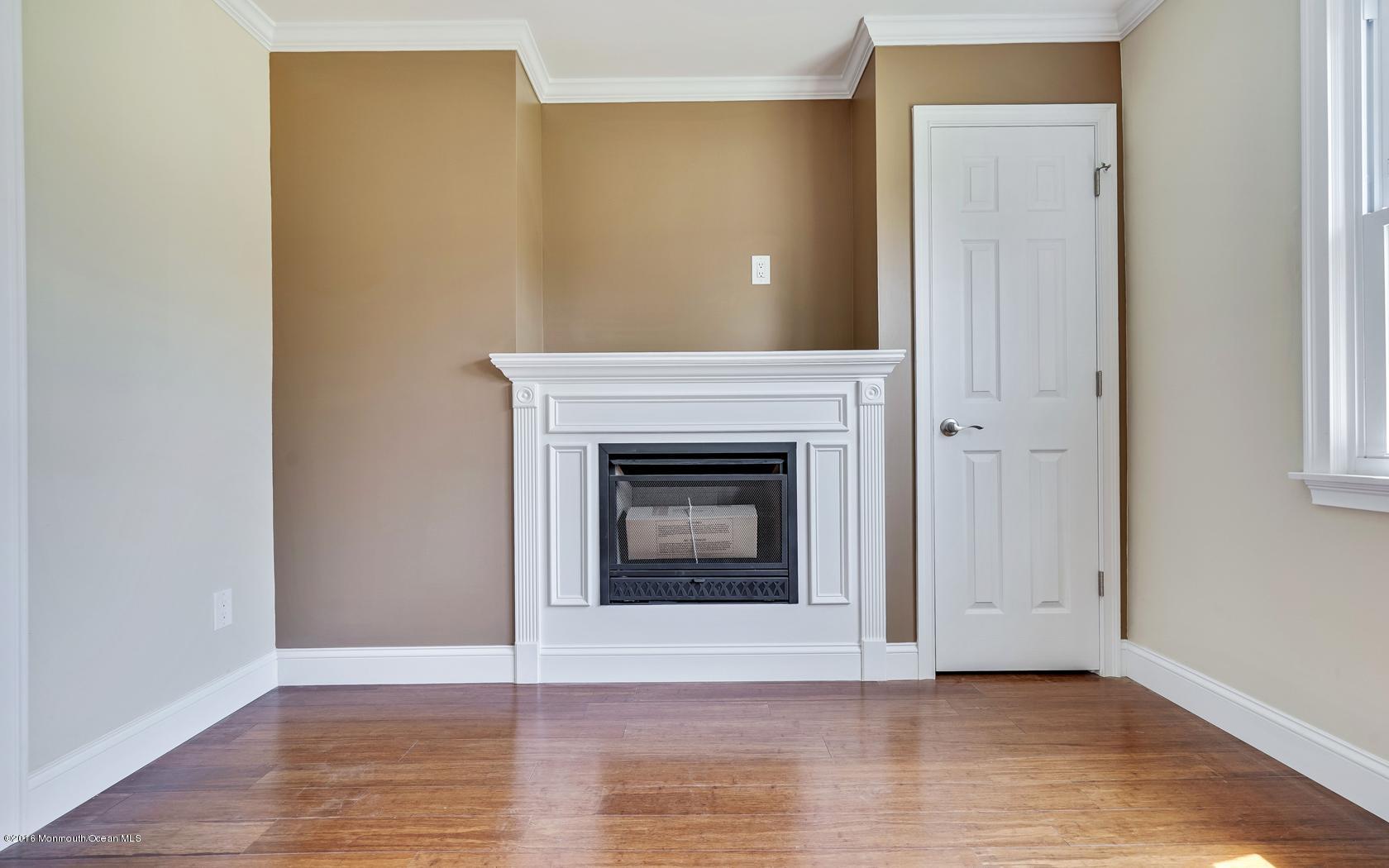 7 Coventry Road Toms River, NJ 08757 - Photo 18 of 34 a view of a livingroom with a fireplace