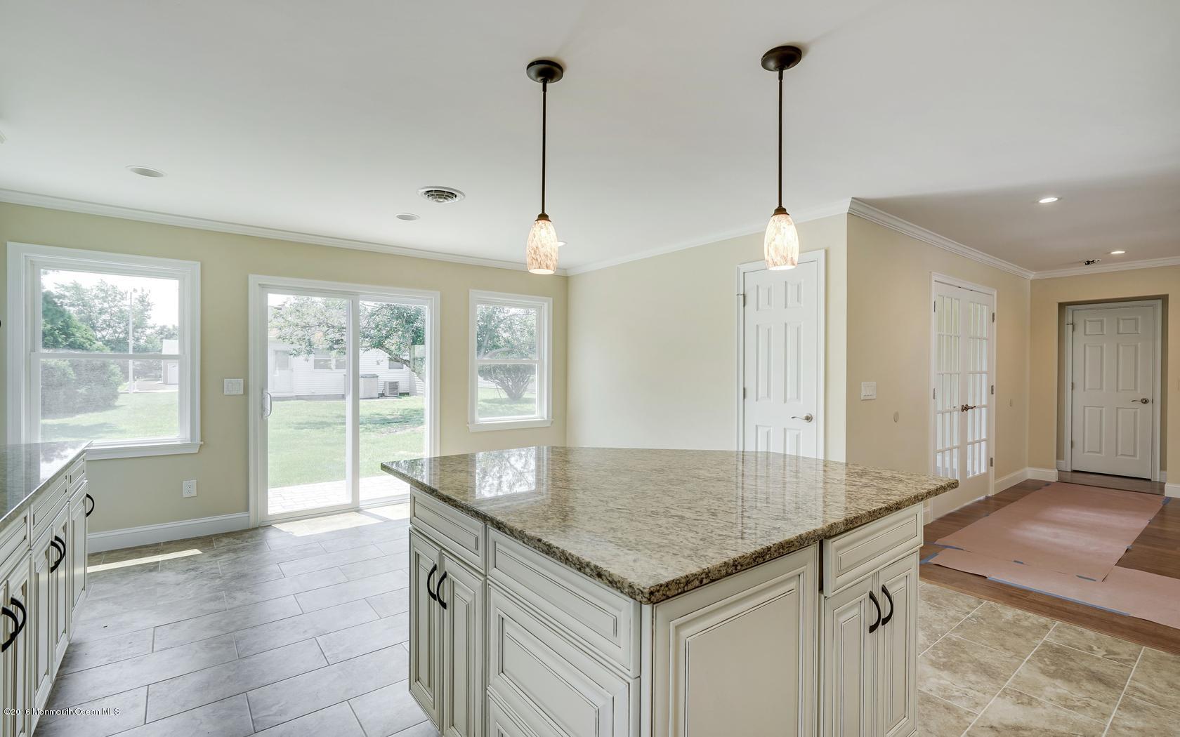 7 Coventry Road Toms River, NJ 08757 - Photo 23 of 34 a kitchen with stainless steel appliances granite countertop a sink and a granite counter tops