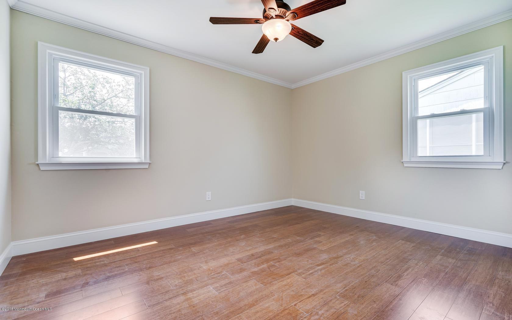 7 Coventry Road Toms River, NJ 08757 - Photo 26 of 34 a view of a room with wooden floor and windows