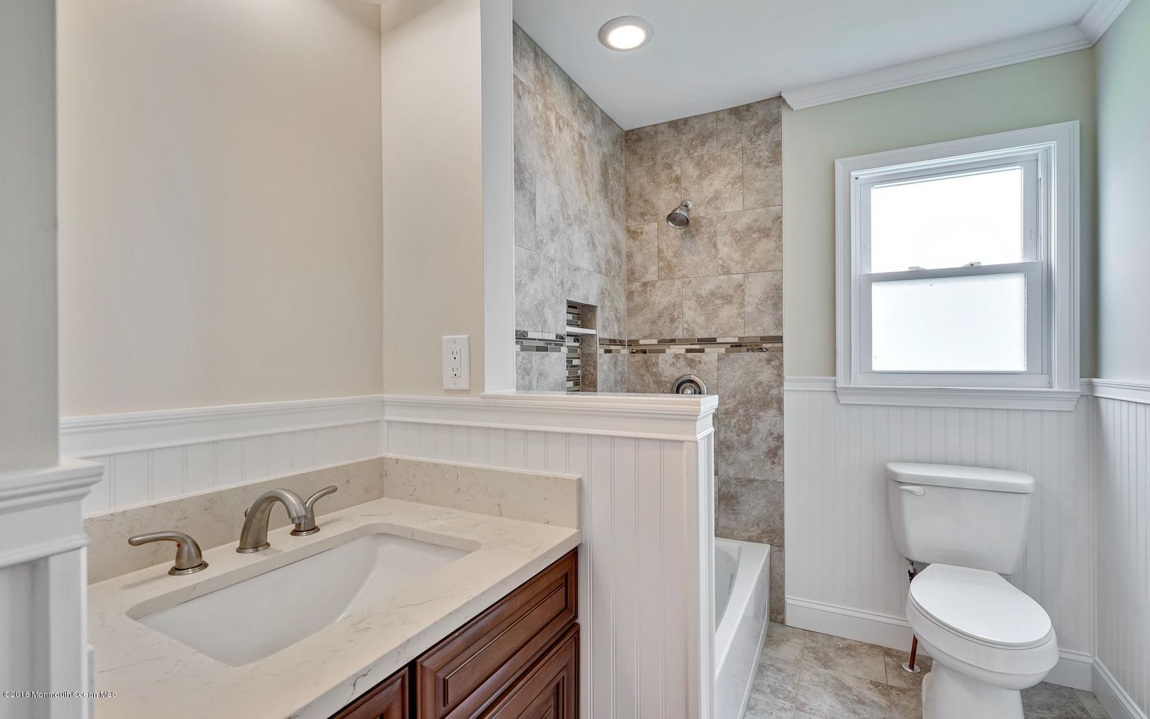 7 Coventry Road Toms River, NJ 08757 - Photo 27 of 34 a bathroom with a sink toilet vanity and window