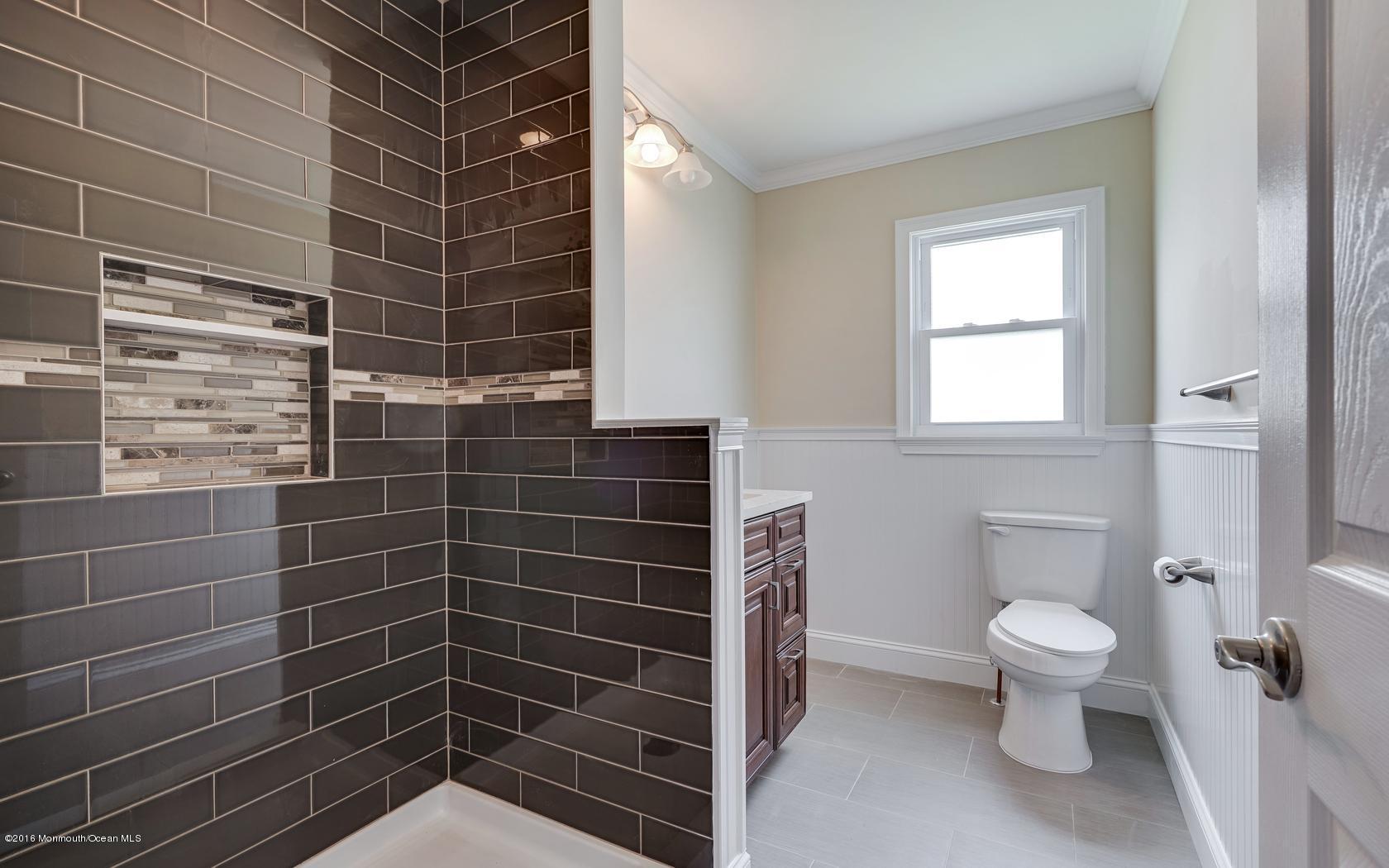 7 Coventry Road Toms River, NJ 08757 - Photo 30 of 34 a bathroom with a toilet and a shower