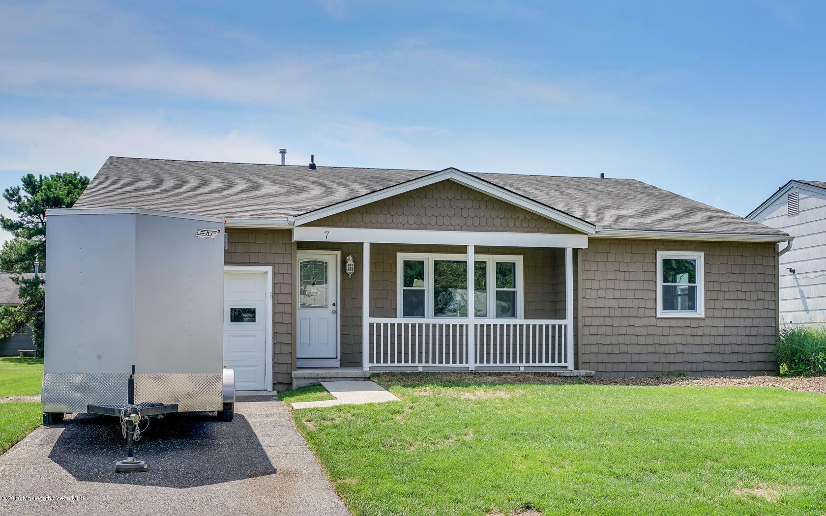 7 Coventry Road Toms River, NJ 08757 - Photo 5 of 34 a front view of a house with a yard
