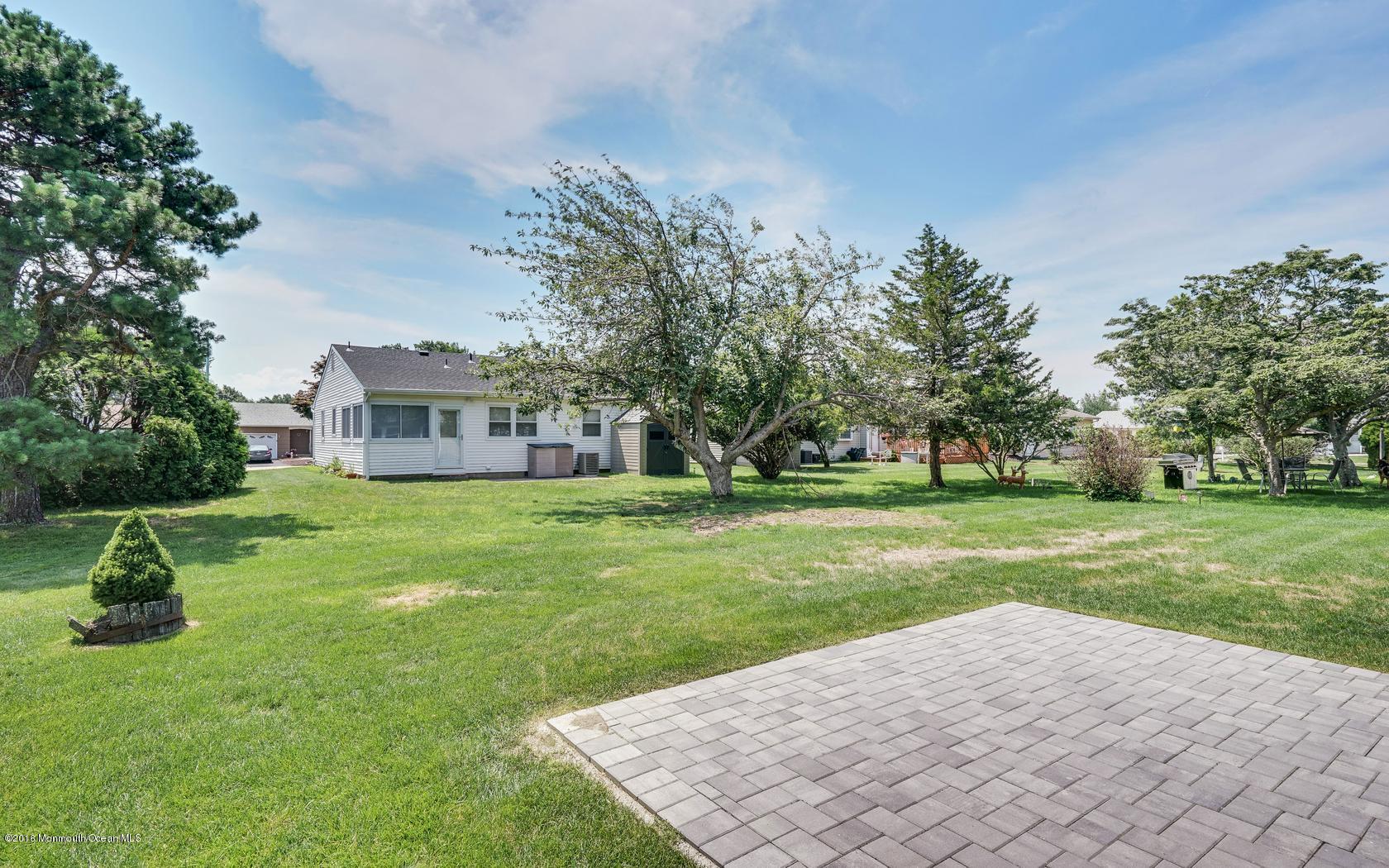 7 Coventry Road Toms River, NJ 08757 - Photo 8 of 34 a view of a house with a yard