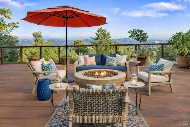 a view of balcony with outdoor seating and wooden floor