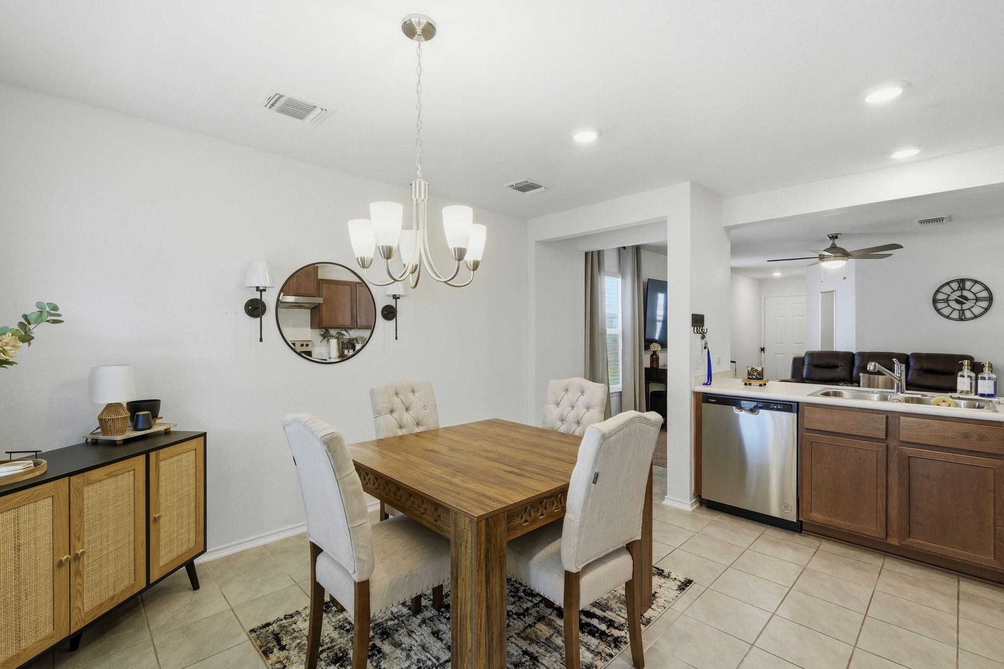 220 Lucky Texan Road Jarrell, TX 76537 - Photo 7 of 19 A well-lit dining area featuring elegant seating and seamless kitchen access.