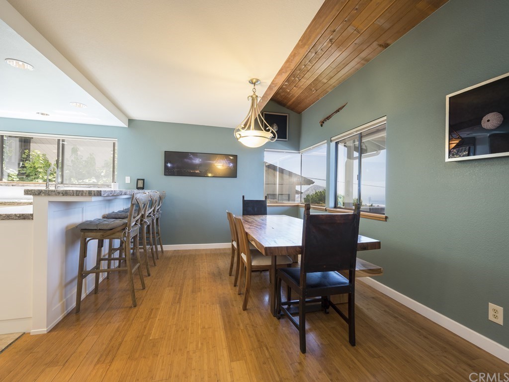 2630 Maple Avenue Morro Bay, CA 93442 - Photo 11 of 49 a view of a dining room with furniture and wooden floor