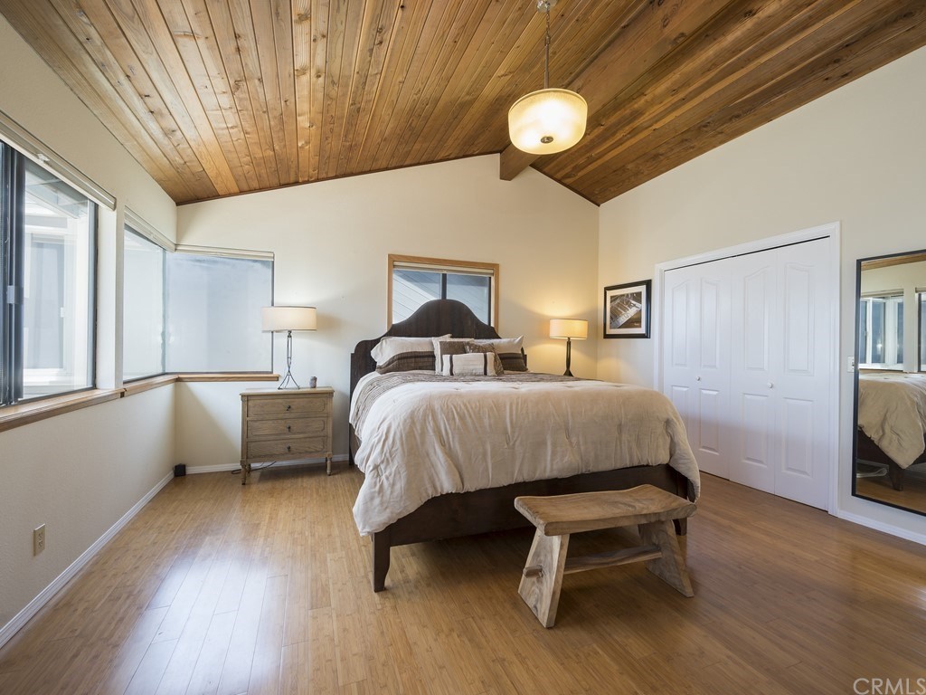 2630 Maple Avenue Morro Bay, CA 93442 - Photo 26 of 49 a bedroom with a bed and a large window