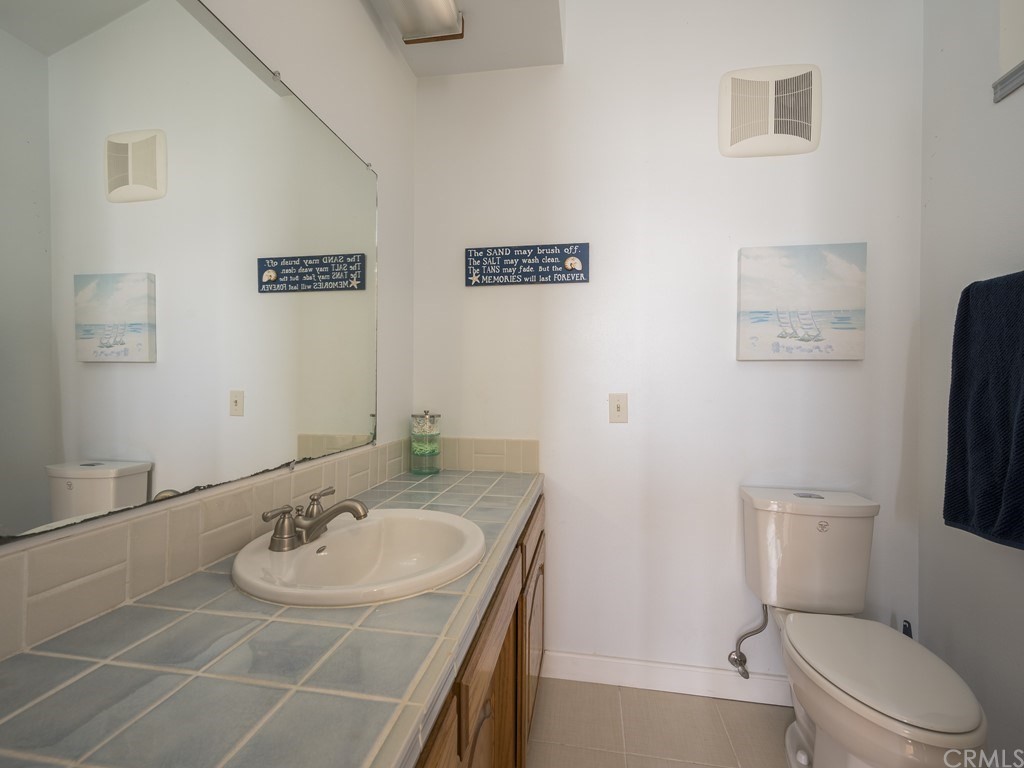 2630 Maple Avenue Morro Bay, CA 93442 - Photo 34 of 49 a bathroom with a sink toilet and a mirror