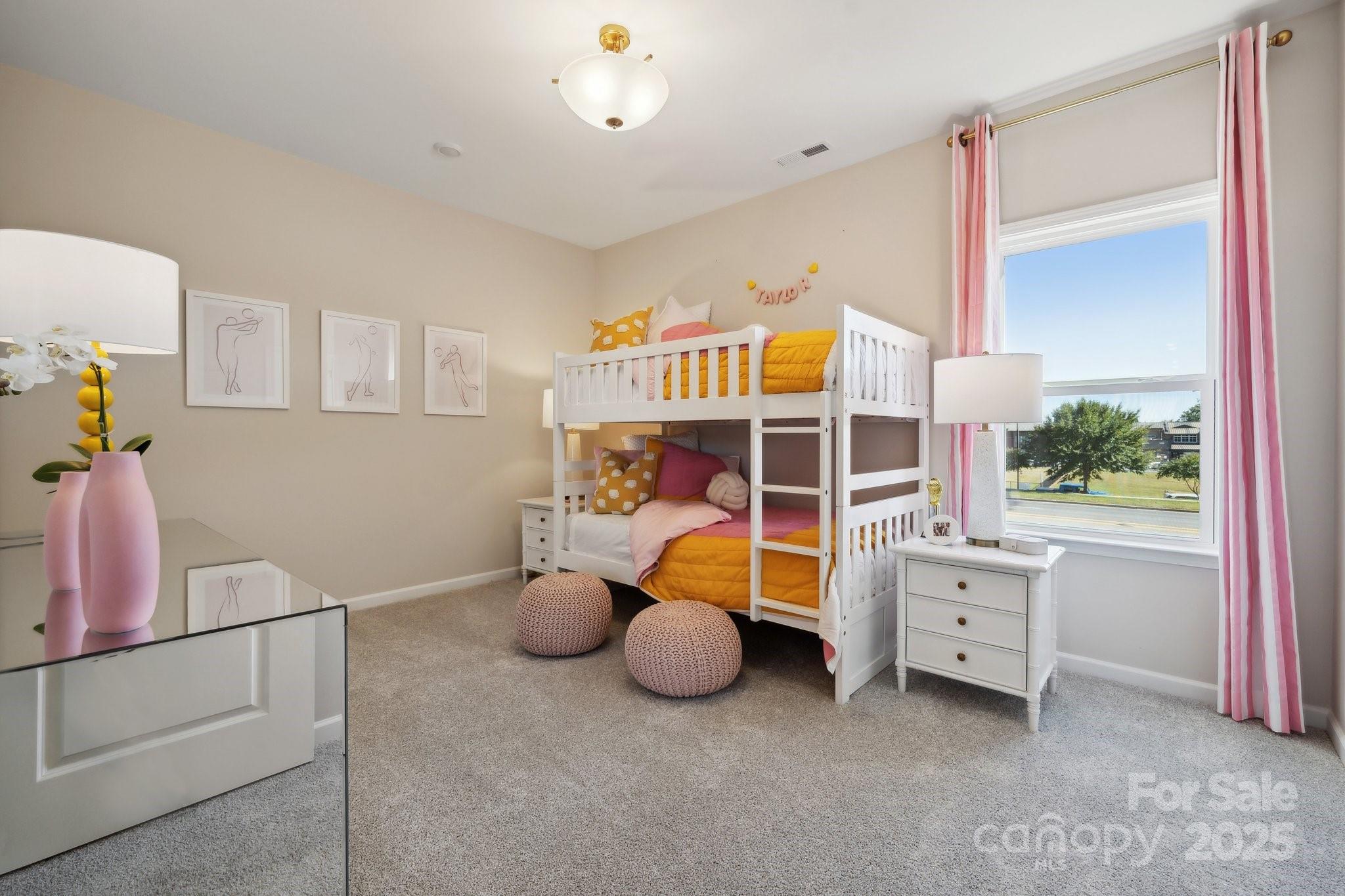 5049 Duval Circle Tega Cay, SC 29708 - Photo 25 of 31 a bedroom with furniture and a window
