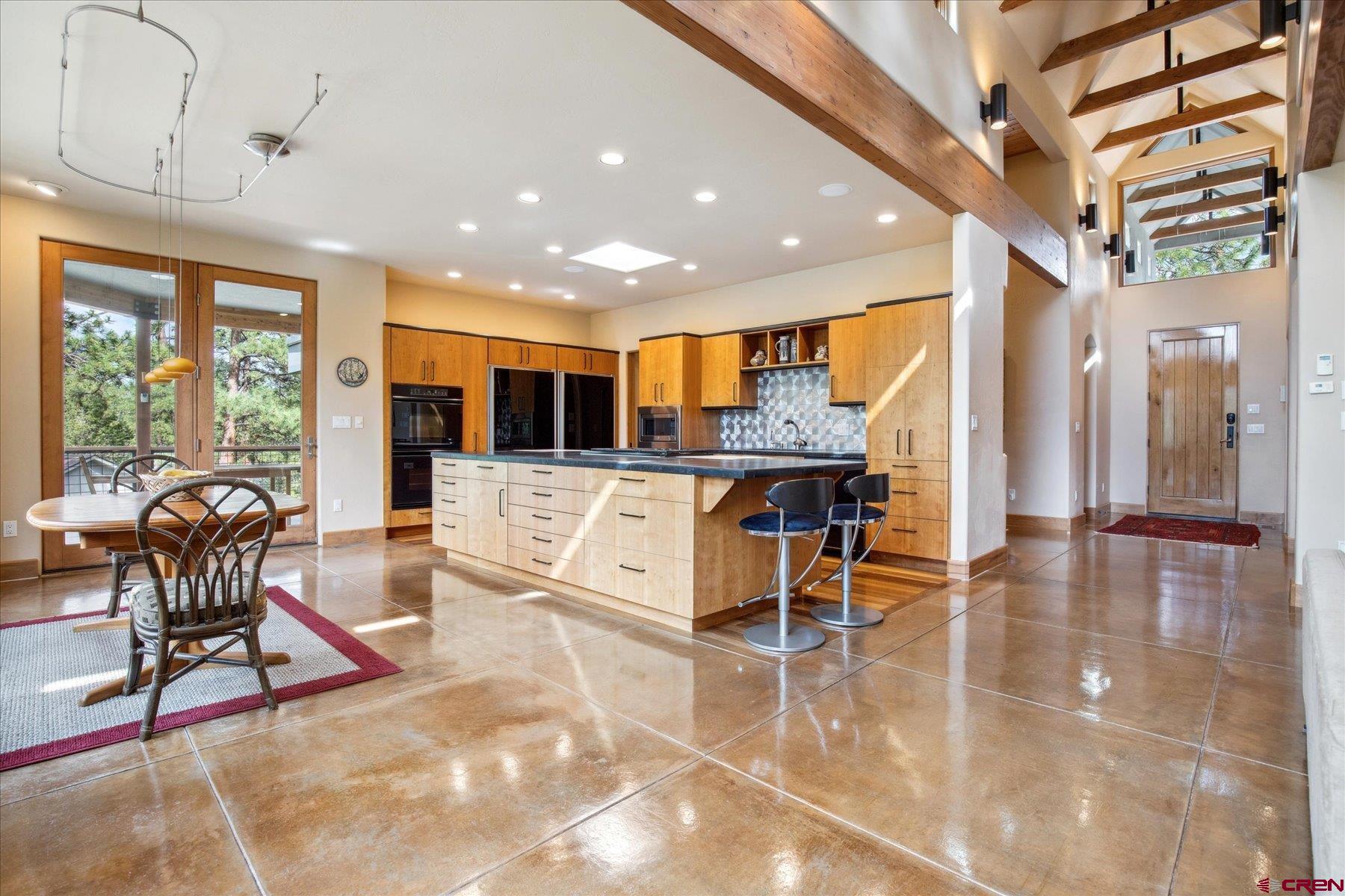 152 Peak Trail Drive Durango, CO 81303 - Photo 12 of 44 a view of a patio with table and chairs