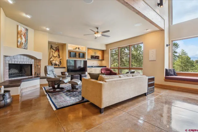 a living room with furniture and a fireplace